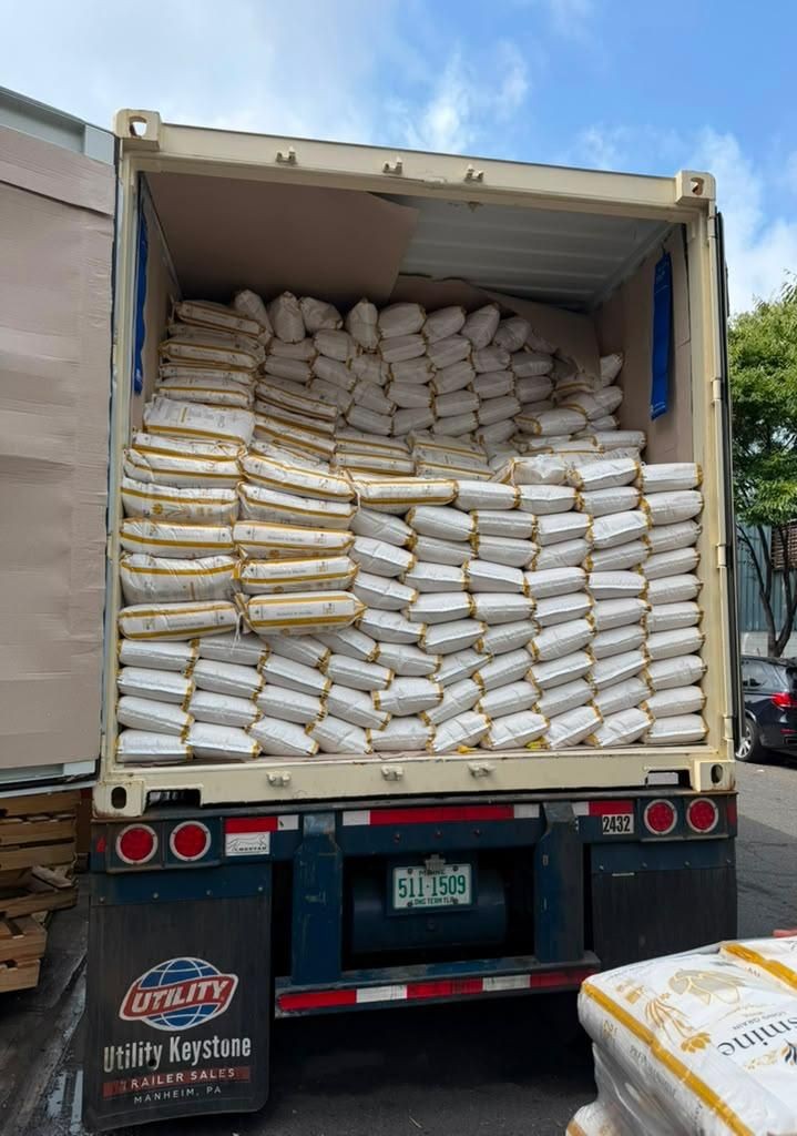 Container of prepackaged Jasmine rice bags arriving at the Bronx warehouse